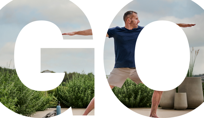 Rex, a GOCOVRI patient, doing yoga while practicing his Warrior II pose.