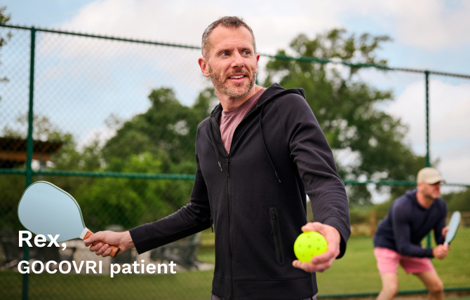 GOCOVRI patient Rex getting ready to serve while playing pickle ball. 